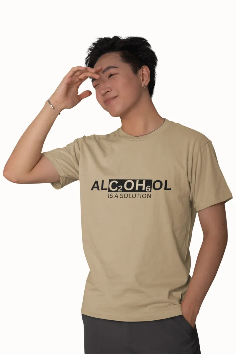 A man wearing a Beige brown T-shirt with black 'ALC₂OH₆ is a Solution' chemistry graphic