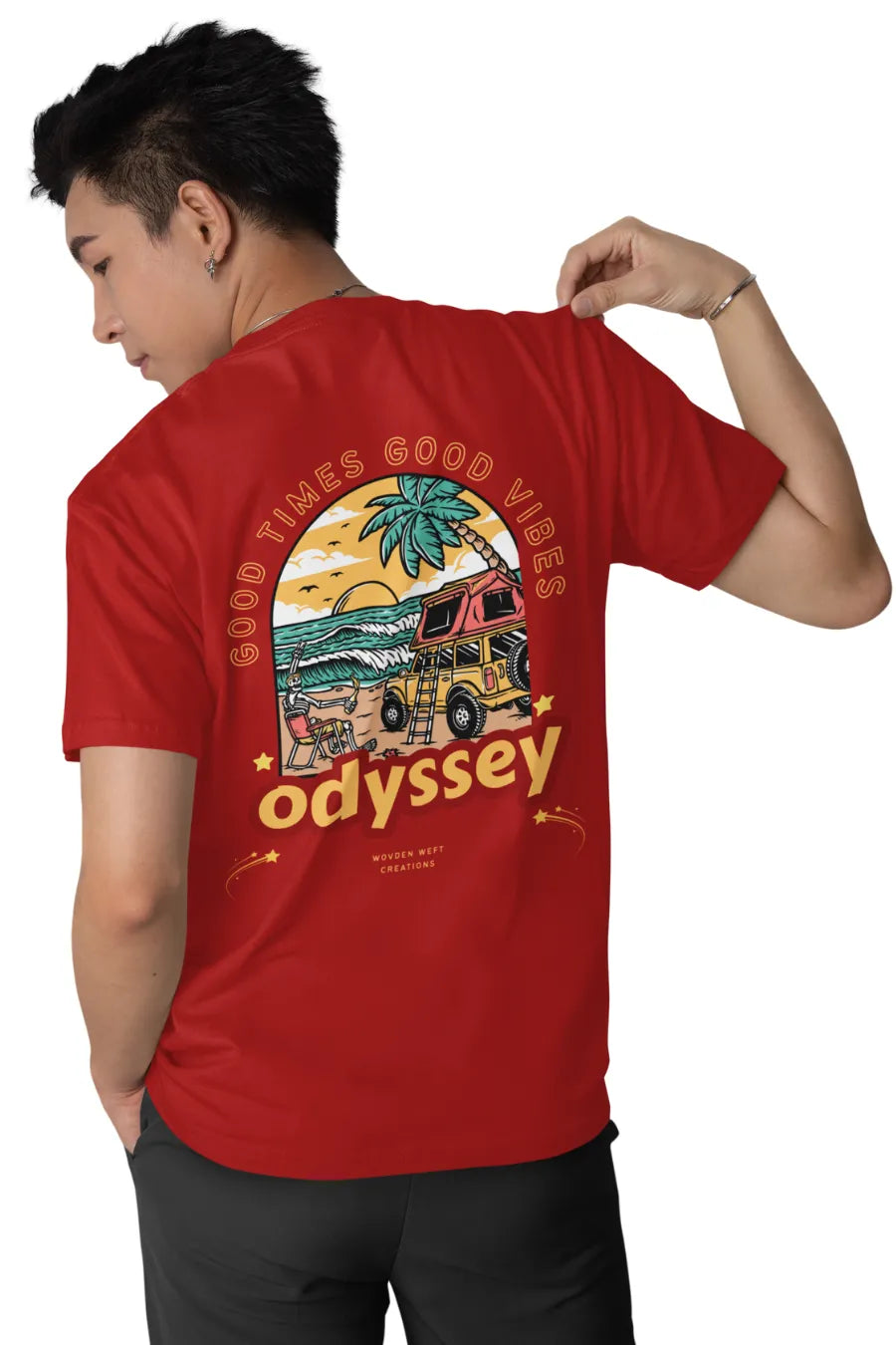 Man wearing a Red double impact T-shirt with 'Good Times Good Vibes' text on front and colorful 'Odyssey' beach van graphic on back