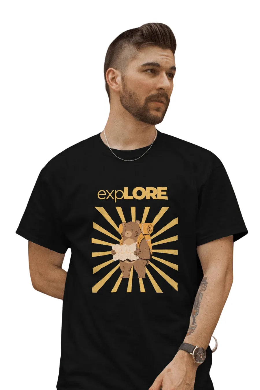 Man wearing a black T-shirt featuring a bear with a backpack and map under sunburst rays with 'Explore' text above.