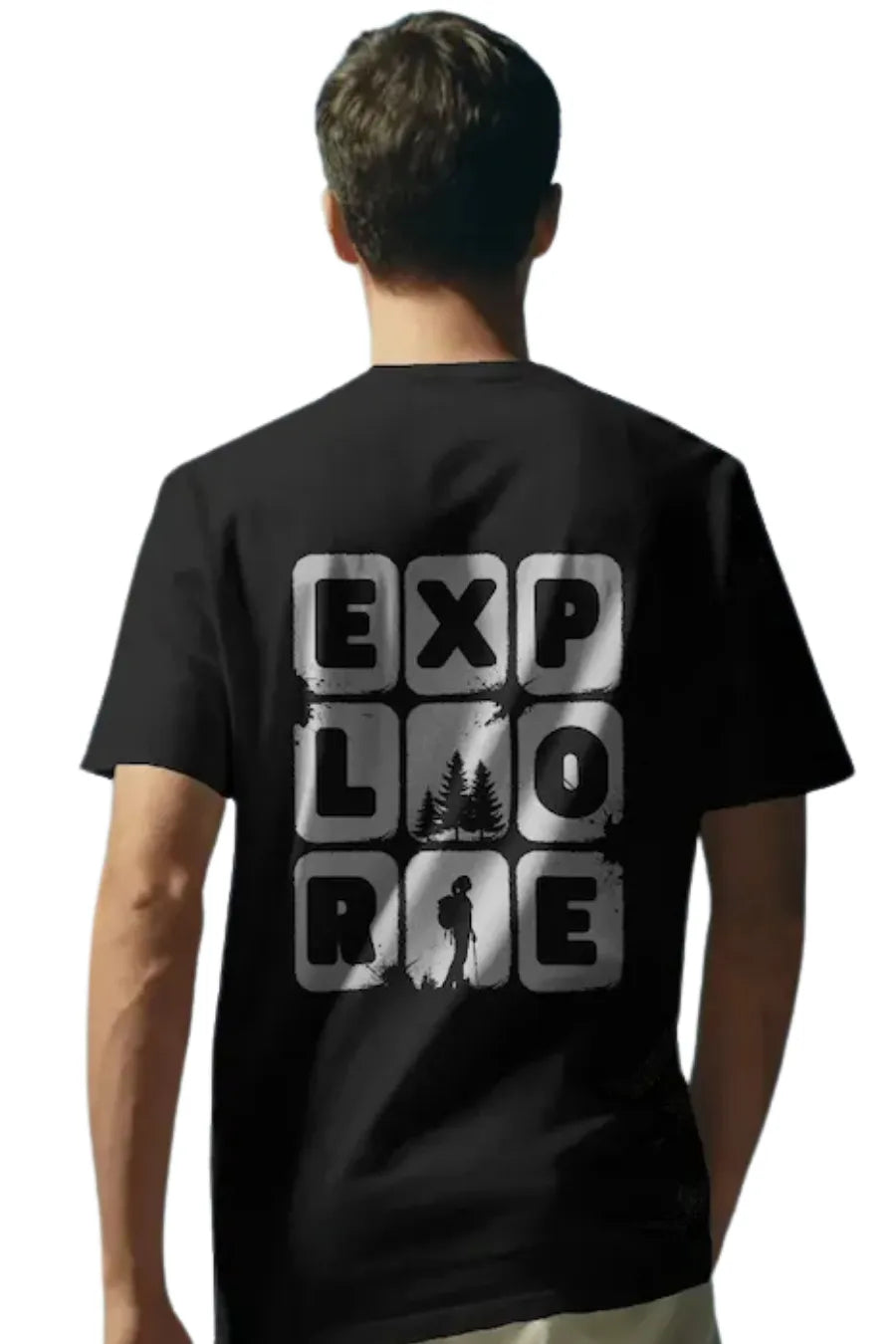 Man wearing a Black T-shirt with large 'Explore' text graphic and silhouette of trees and hiker on the back.