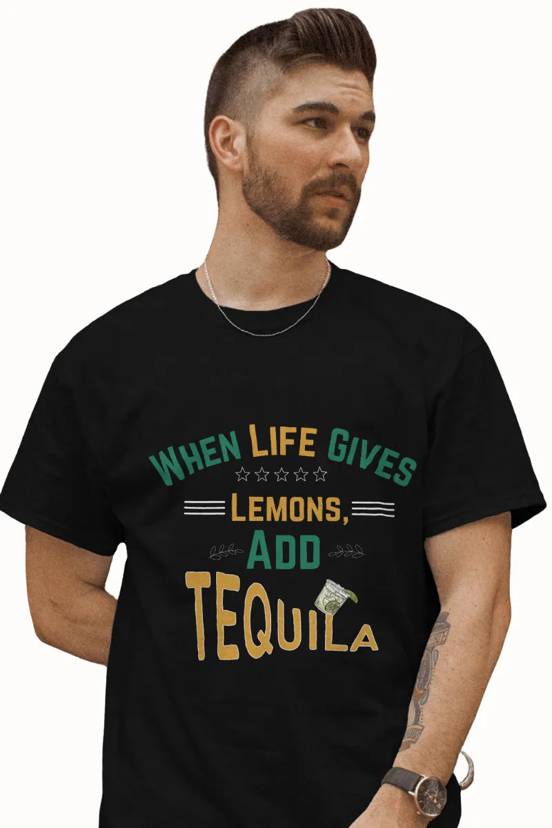 A man wearing a Black t-shirt with When Life Gives Lemons Add Tequila text and cocktail glass