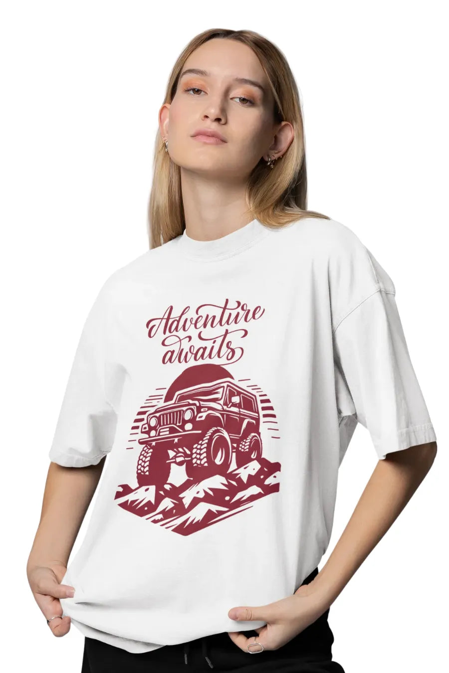 Woman in white oversize t-shirt with Adventure Awaits jeep and mountain graphic