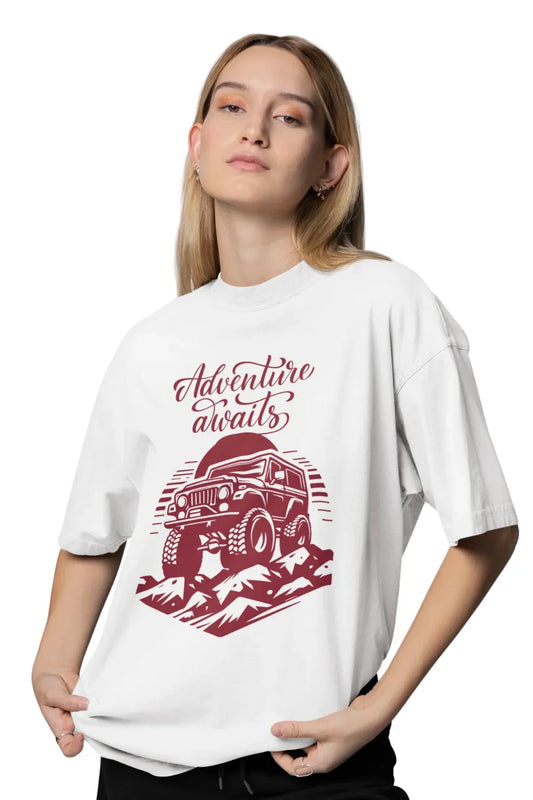 Woman in white oversize t-shirt with Adventure Awaits jeep and mountain graphic