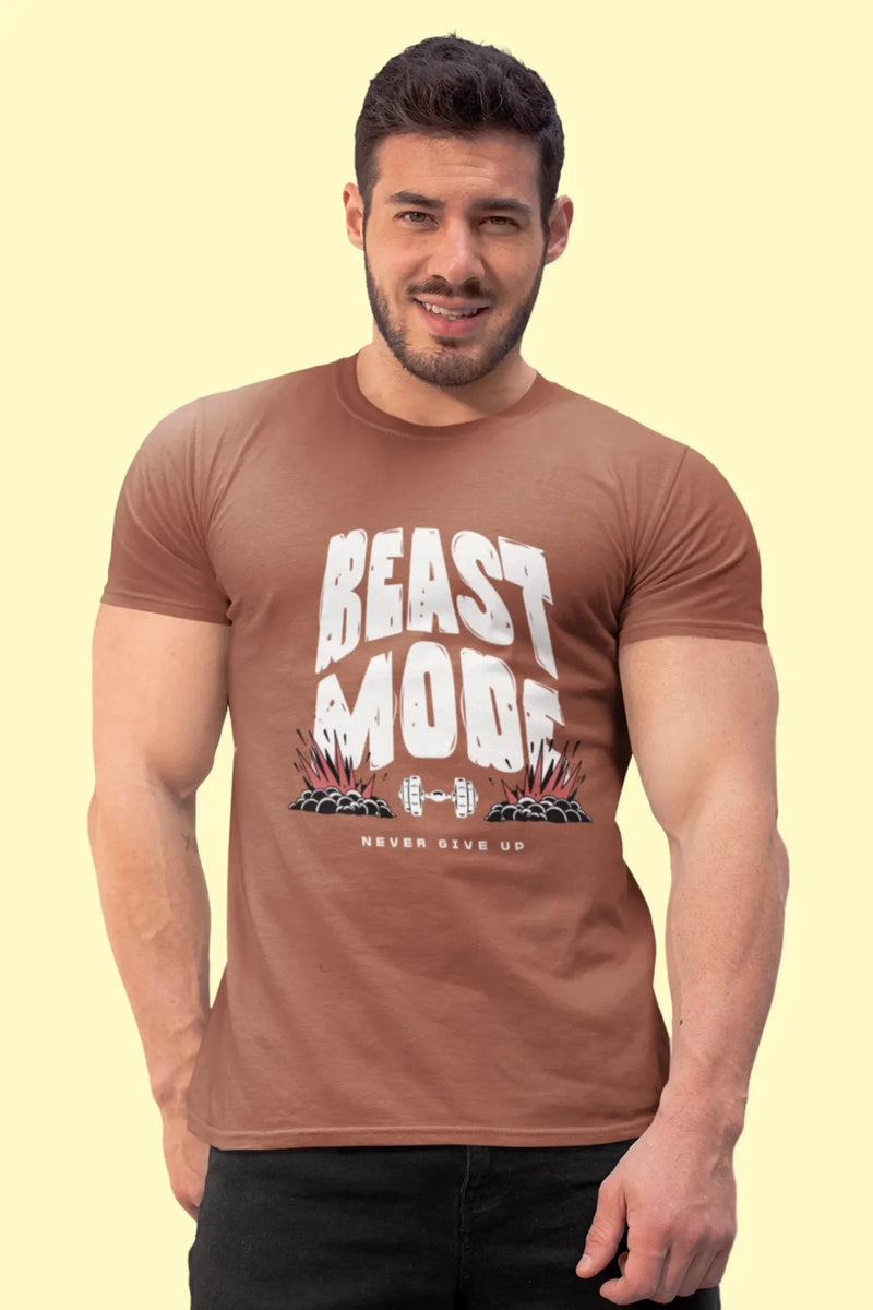 Man wearing a rust brown shade cotton t-shirt with bold white “Beast Mode” and “Never Give Up” quote printed. Fitness-themed regular and relaxed fit tee.