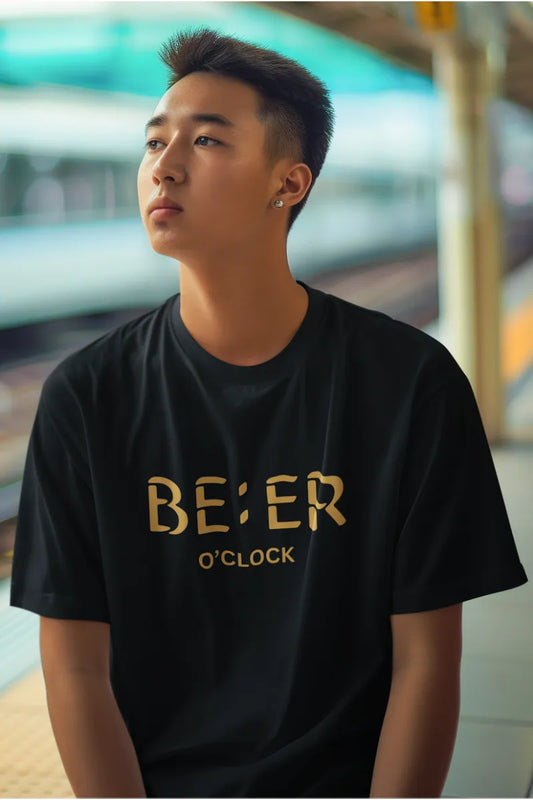 A man wearing a Black T-shirt with golden 'Beer O’Clock' quote printed on chest