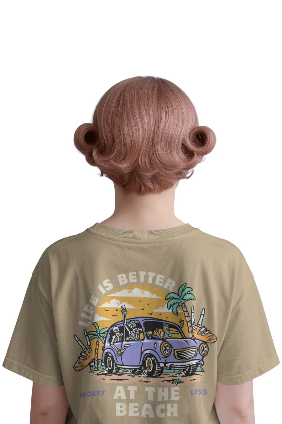 Back view of woman in beige relaxed t-shirt with skeletons, car, and palm trees at the beach