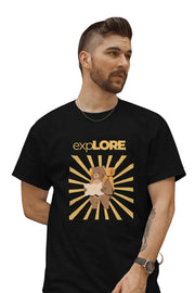 Man wearing a black T-shirt featuring a bear with a backpack and map under sunburst rays with 'Explore' text above.