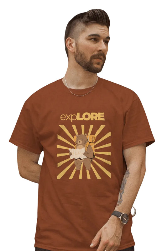 Man wearing a rust brown T-shirt featuring a bear with a backpack and map under sunburst rays with 'Explore' text above.