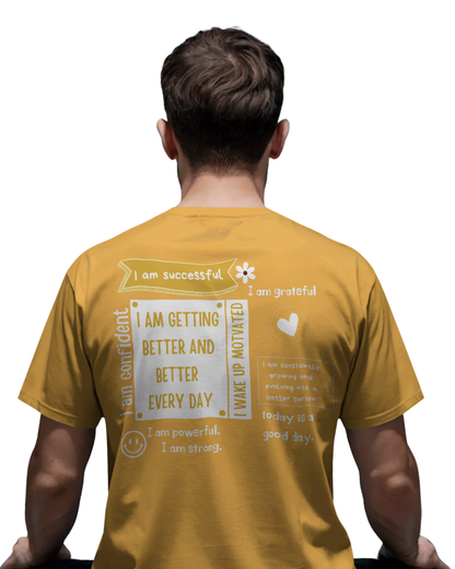 Man wearing mustard yellow t-shirt with motivational quotes like “I am confident,” “I am successful,” and “Getting better every day” printed on the back and front.