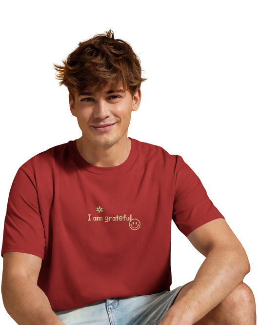 Man wearing a red cotton t-shirt with motivational quotes like “I am successful,” “I wake up motivated,” and “Better every day” printed on the back and front.