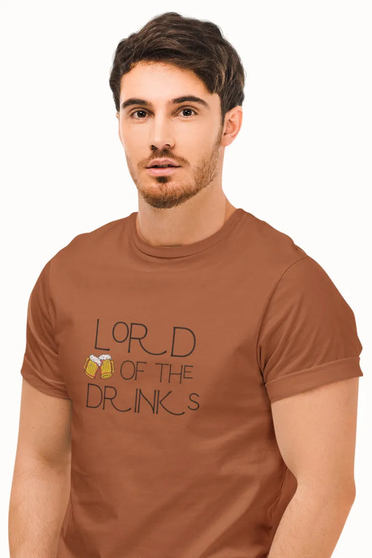A man wearing a Rust brown T-shirt with 'Lord of the Drinks' quote and beer mugs illustration