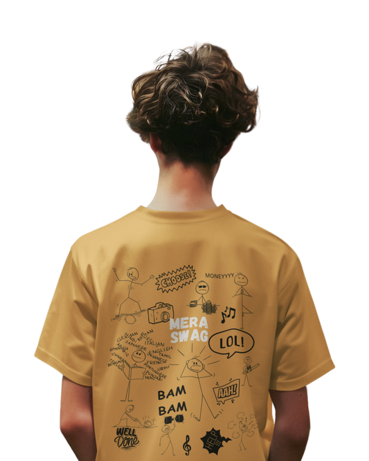 Man wearing a mustard yellow t-shirt with doodle-style stick figures, “Mera Swag,” and fun elements like LOL, BAM BAM, AAH!, and music icons..