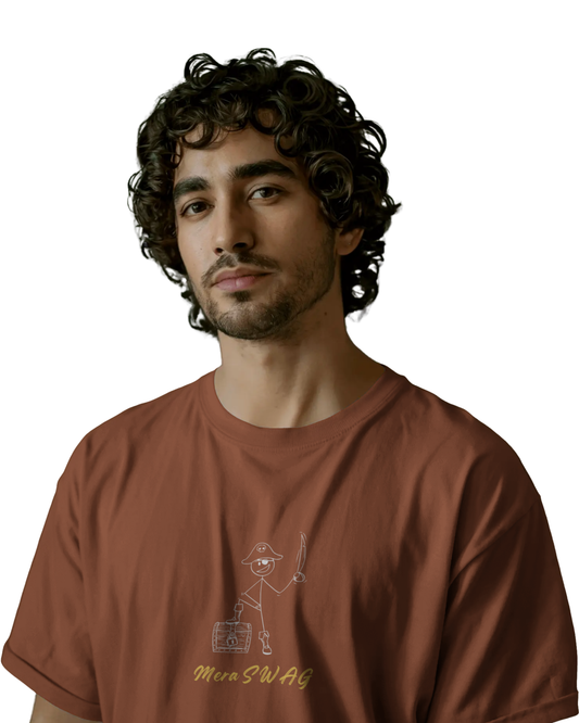 Man wearing a rust brown t-shirt with cartoon doodles and quirky words like “MERA SWAG”, “CHOOSE!”, “LOL”, and “BAM BAM” printed on the back and front.