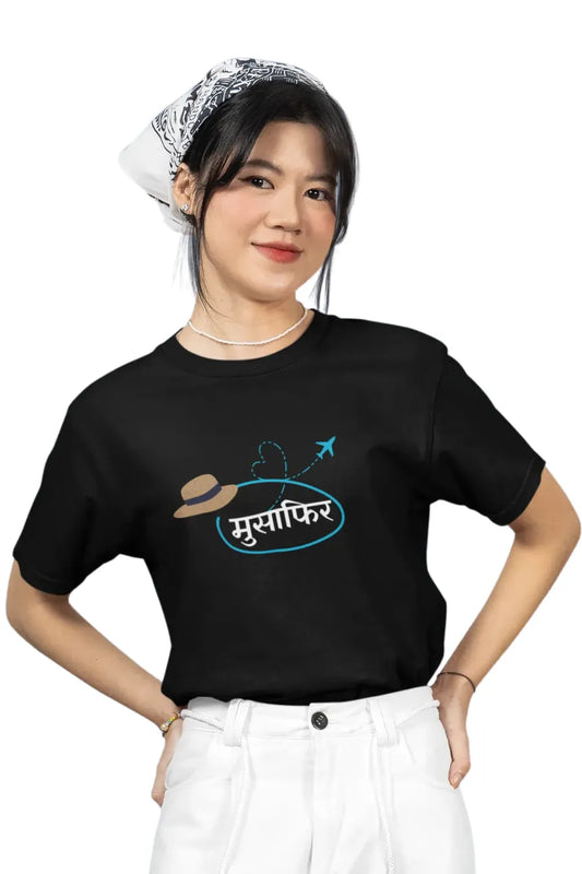 Woman in black Musafir graphic T-shirt with white pants and scarf