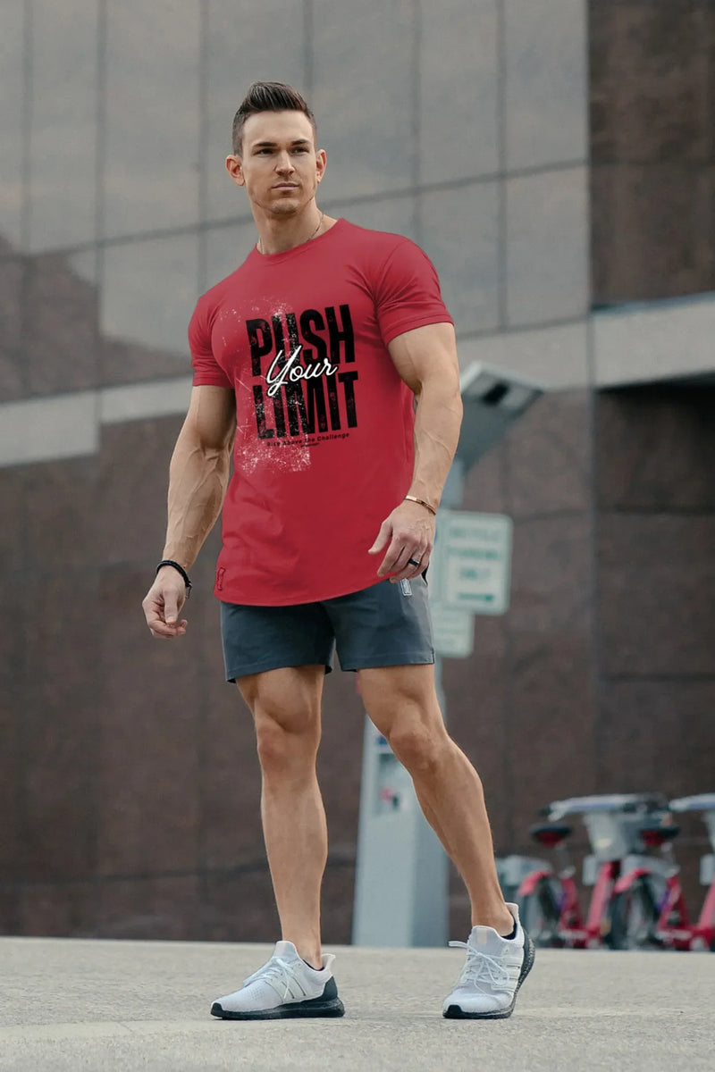 Man wearing a red cotton t-shirt with the quote “Push Your Limit” printed on the front. T-shirt has a regular and relaxed fit, perfect for athletic style.