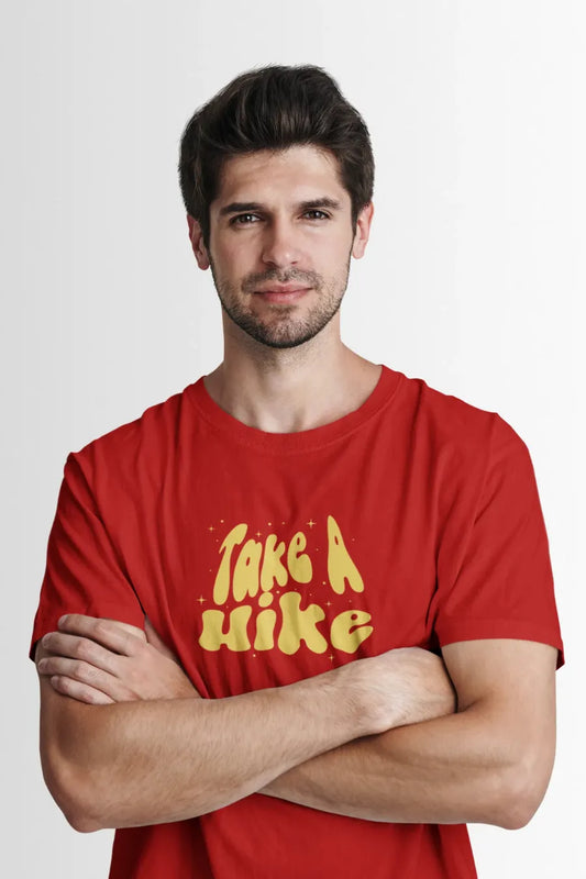 Man wearing a red T-shirt with bold yellow 'Take A Hike' graphic in vintage typography