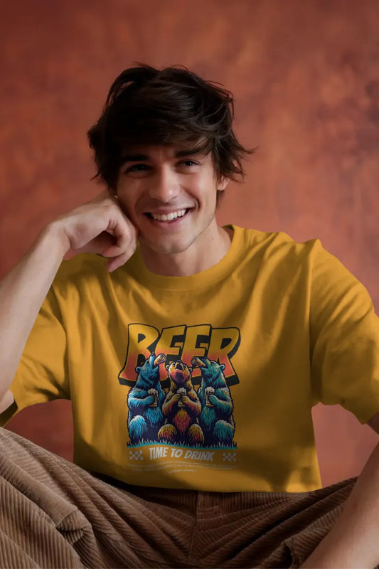 A man wearing a Mustard yellow t-shirt with three colorful bears drinking beer and Time To Drink text