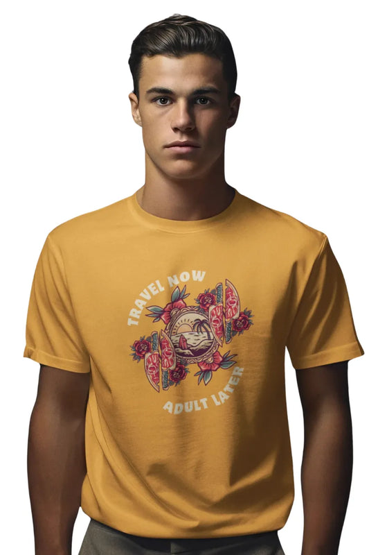Man wearing a mustard yellow T-shirt with 'Travel Now Adult Later' graphic design featuring sunset, waves, and floral elements