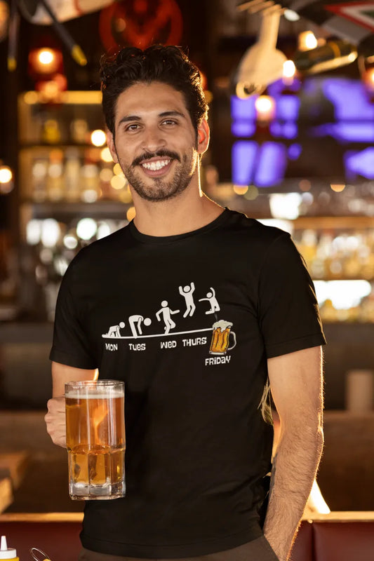 A man wearing a Black t-shirt with stick figure evolution from Monday to Friday beer mug